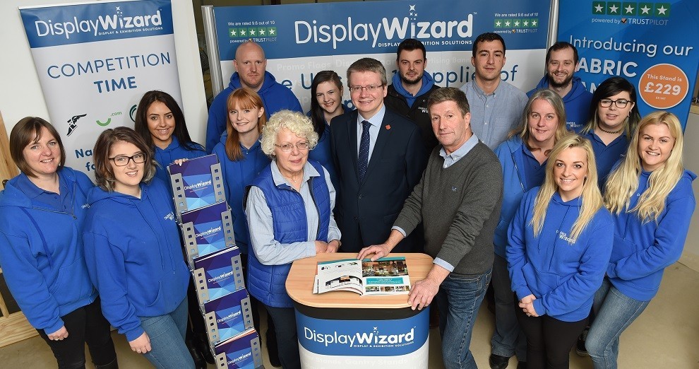 Display wizard team with Cllr Green at reception website