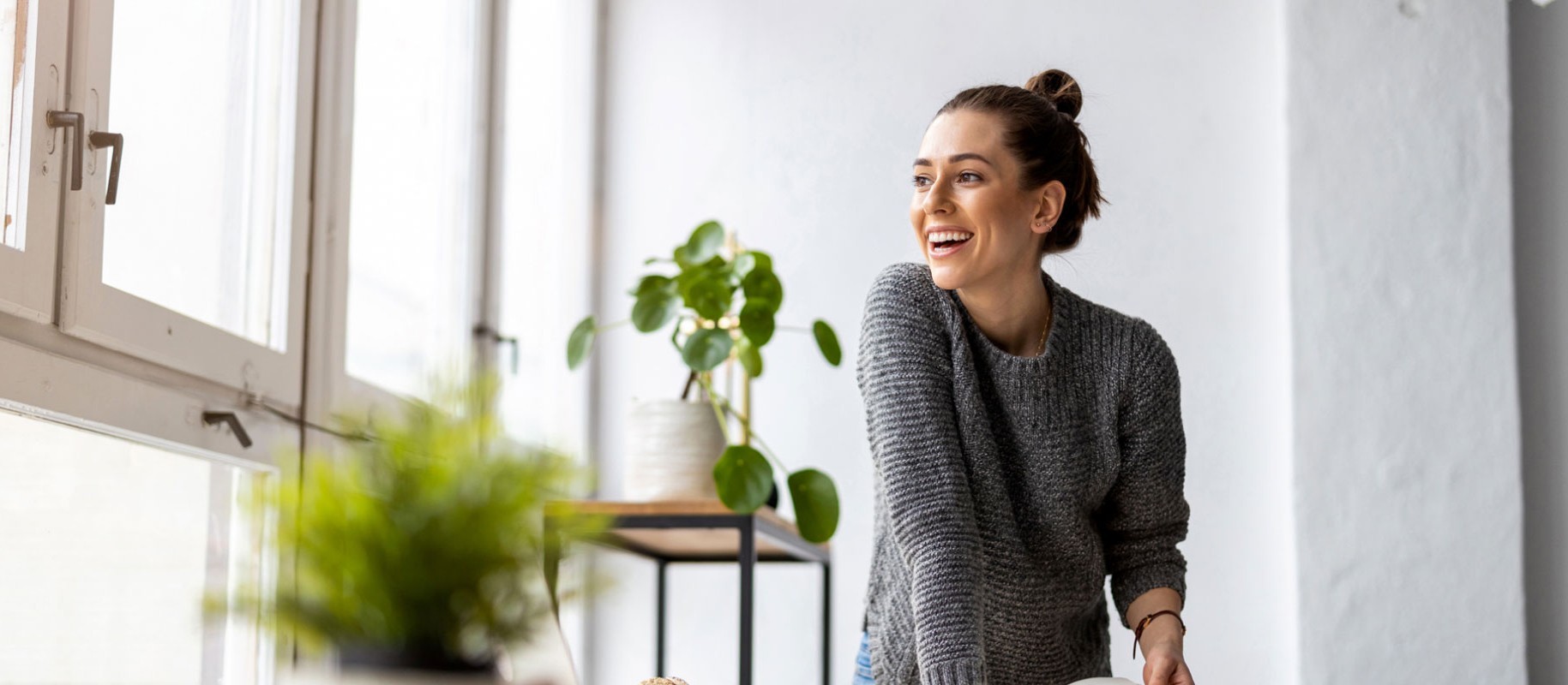 woman in office looking out the window