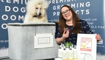 Angela Pinder with with her Poodle Dougal and her award winning products from Paw Naturel web