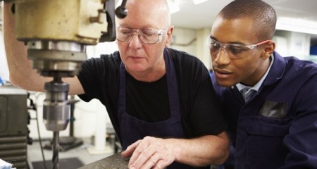worker_teaching_apprentice_manufacturing_skills___web 2