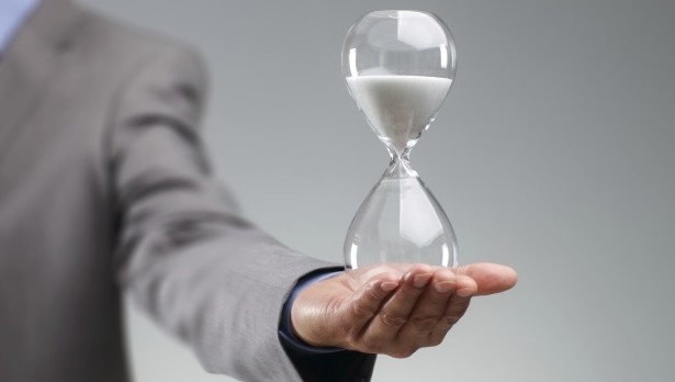 businessman_holding_hourglass___web 2