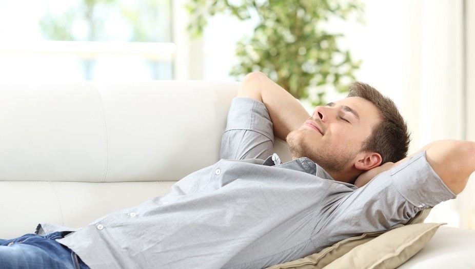Man chilling out on couch BANNER
